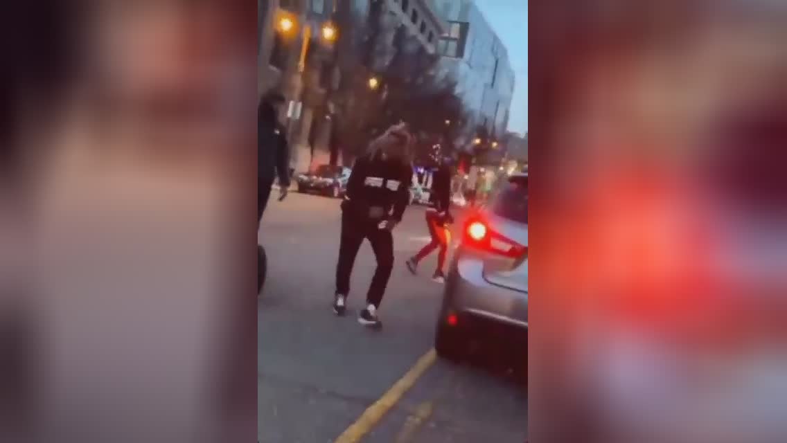 An angry guy smashes his opponent’s automobile with stones