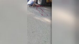 Lesser half of guy's physical body crushed through large trailer