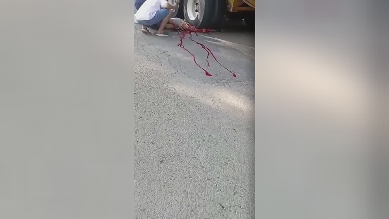 Lesser half of guy’s physical body crushed through large trailer
