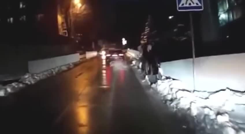 A car hits a woman in a crosswalk russia