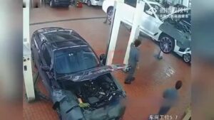 A vehicle service laborer was squashed by an auto that decreased