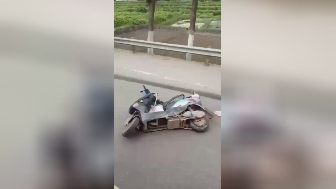 A lifeless aged guy looks out of under the steering wheel of a truck