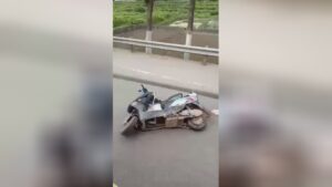 A lifeless aged guy looks out of under the steering wheel of a truck