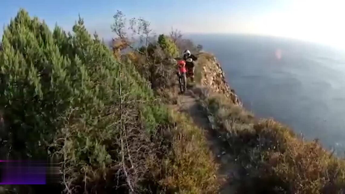 A guy on a pitbike stumbled and also fell off a cliff