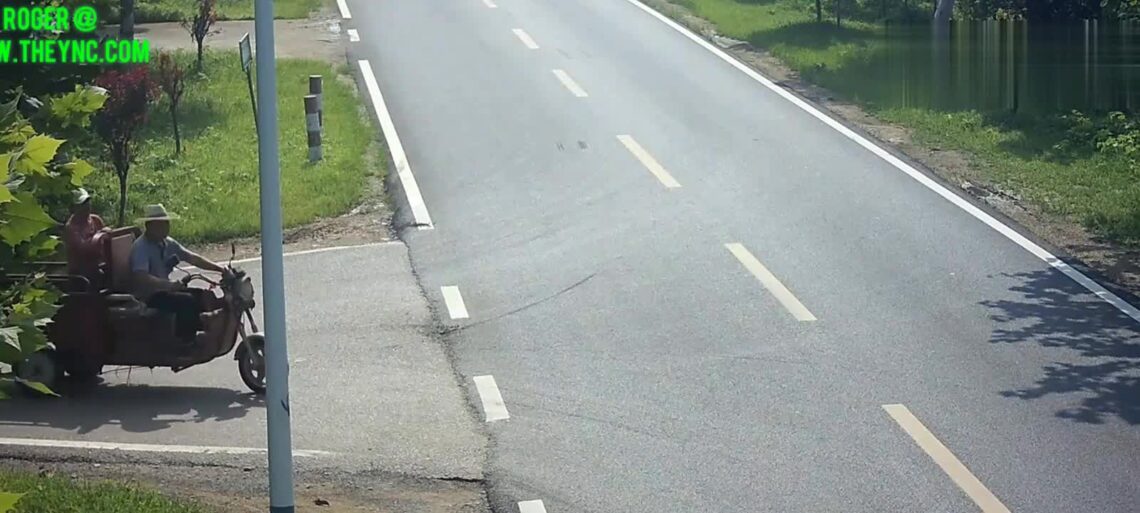 A motor-driven trike tip toes into a trailer