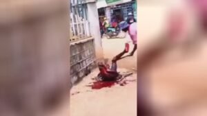 Guy attempts to stab a guy along with a machete in the center of the road