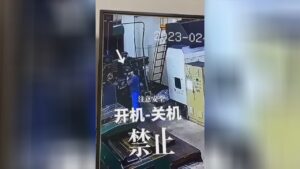Blue-collar worker is pulled right into maker however