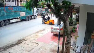Forklift makes bicycle rider's day extra fascinating