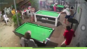 Swimming pool game interrupted with headshots