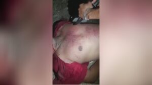 Cartel members carve tcd into the chest of a member