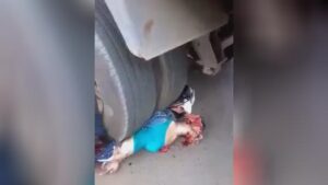 Squashed lady under a truck