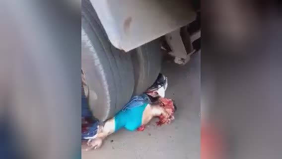 Squashed lady under a truck