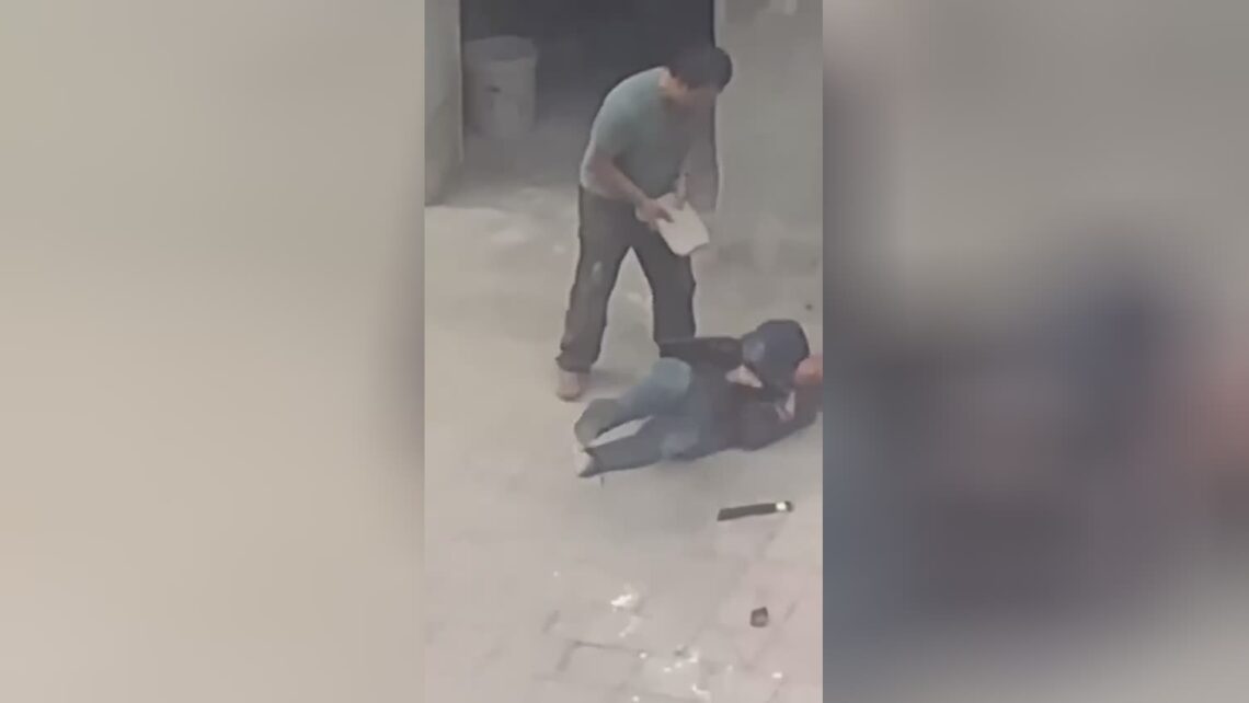 Old fella brutalized along with cement slab