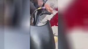 The broken physical body of a guy under the tires of a vehicle