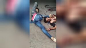 The man's staying hand waves to the onlookers