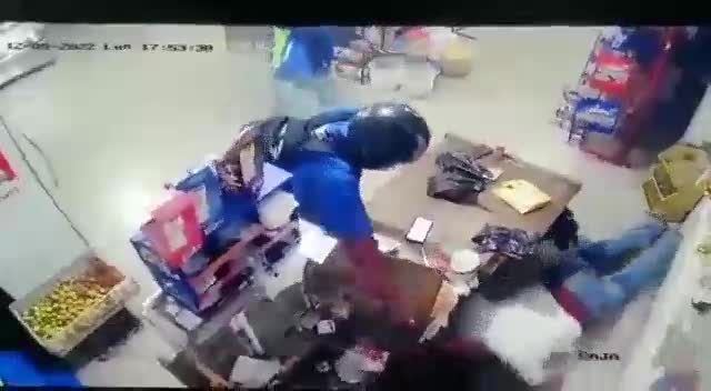 Two burglars using motorcycle helmets robbed as well as shot