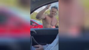 Unhinged roid raging guy credits car home window with his basic hand