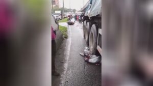 Girl riding a motorbike crushed through a truck