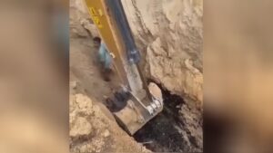 Worker is hidden to life with rocks