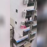 Gal tumbles coming from apartment while attempting to go up