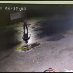 Guy sets in the road and ran over