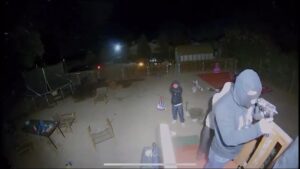 The crooks pushed the guy at gunpoint to open up the door 1 The crooks pushed the guy at gunpoint to open up the door