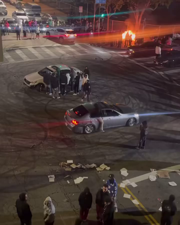 Driver Is Seen Discarding A Stolen Infiniti Into A Fire Pit At A Sideshow In Los Angeles