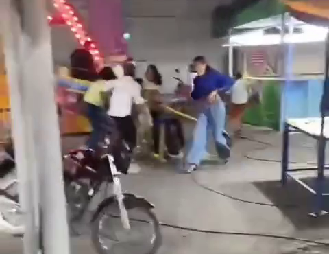 A man shot down in a motorcycle helmet in the amusement park