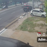 An Out-Of-Control Car Hits A Motorcyclist And Crashes Into A Parked Car