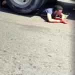 A Guy Under The Wheels Of A Truck Begs For Help
