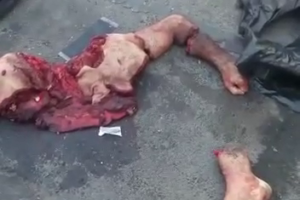 Workers Are Removing The Body Parts Of The Mutilated Motorcyclist From The Road