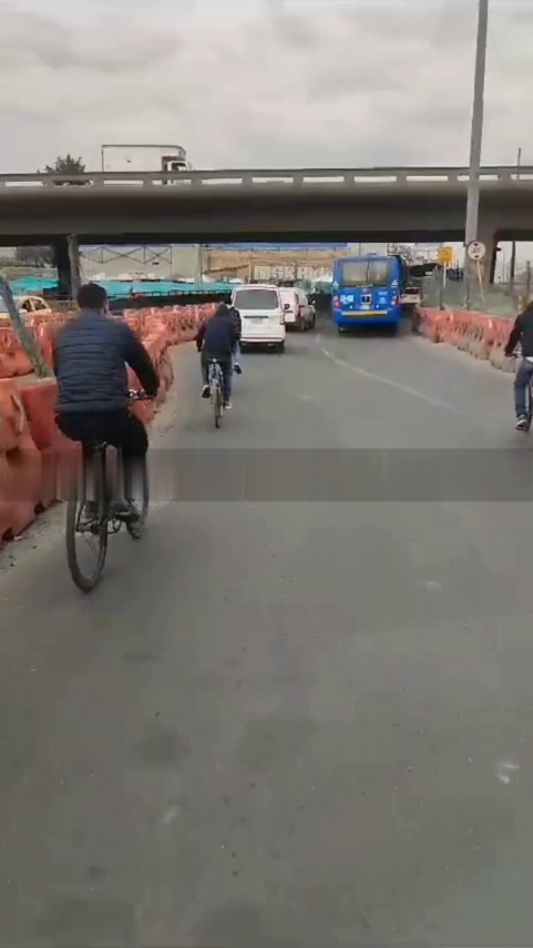 A Gang Of Cyclists Robs Private And Public Transport. Bogota, Colombia