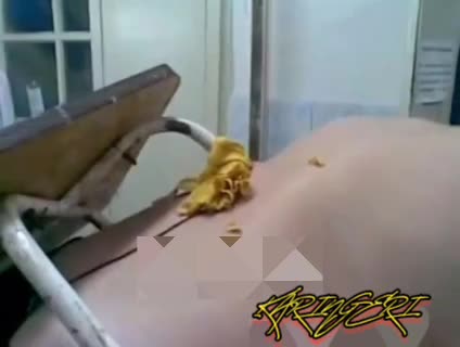 A guy is pierced through with a stool