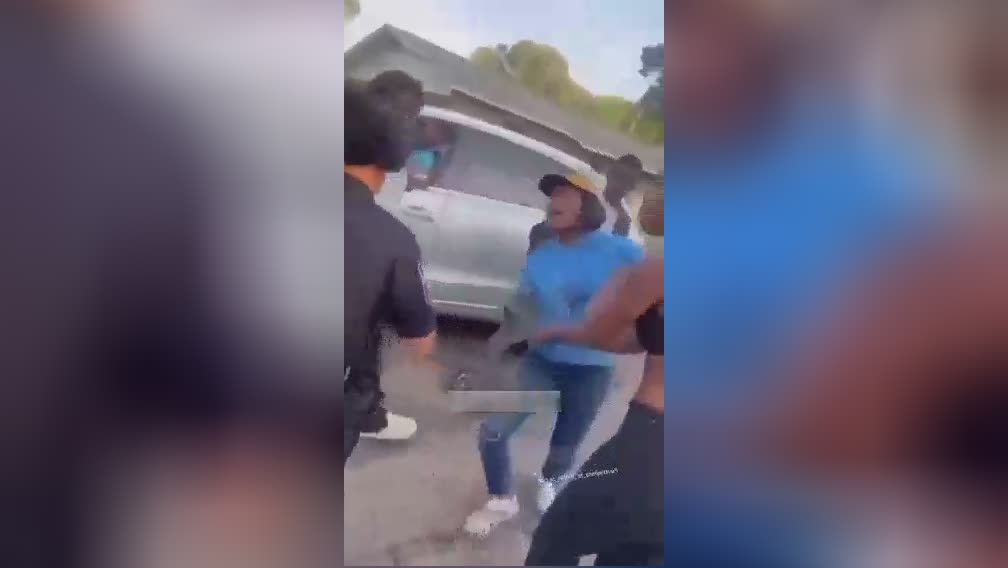 Wigs fly as a female attacks a female law enforcement officer followin