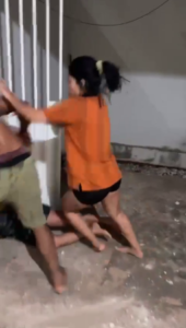 Two Women, A Man And A Shovel