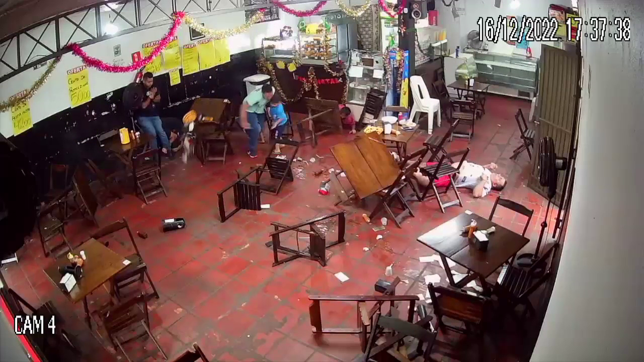 The Head Of The Family Shot During Dinner In Front Of His Children