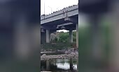 Boy jumps from bridge in India | 18+